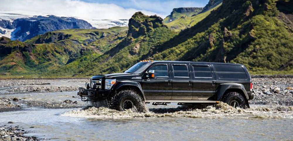 super jeep crossing a river