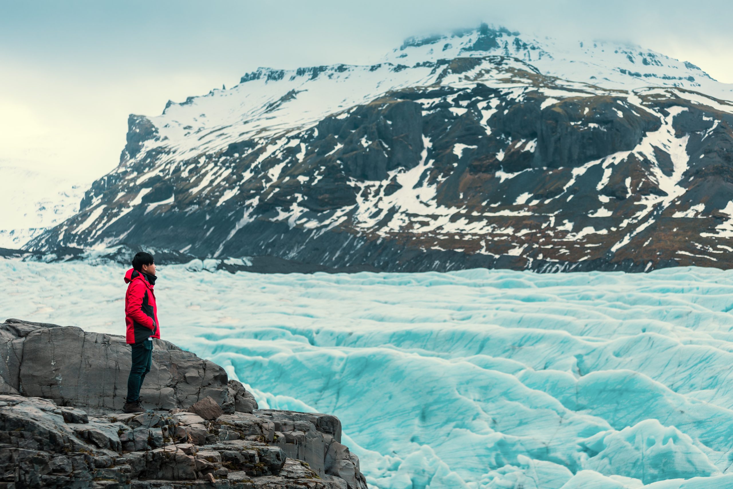 Person in a vacation in Iceland standing on glacier landscape