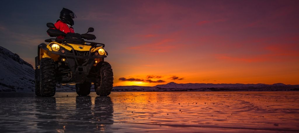 ATV on the beach under the midnight sun