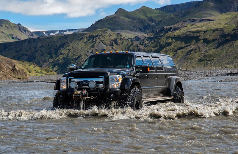 Super Jeep driving in a river in Iceland