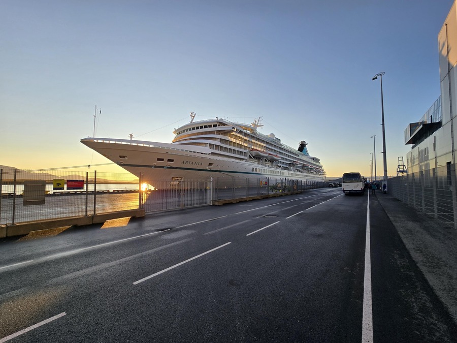 Large cruise ship docked at sunset