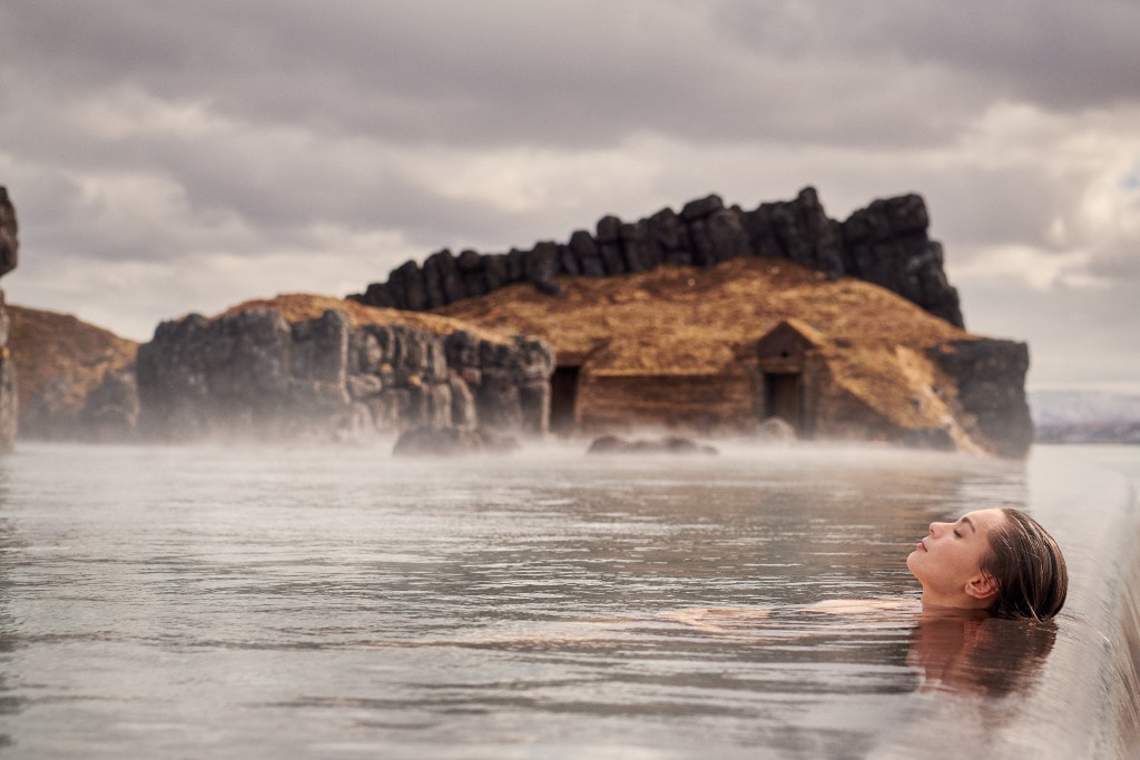 Wellness retreat planning in Iceland featuring a relaxing geothermal spa surrounded by dramatic volcanic scenery.